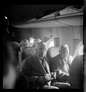 Portrait of (L to R) Mr A B Wright aged 82 and Hugh Wright on a Pan American Airways Clipper Class Kathay DC4 passenger plane Good Will Flight, Whenuapai Airfield, Auckland
