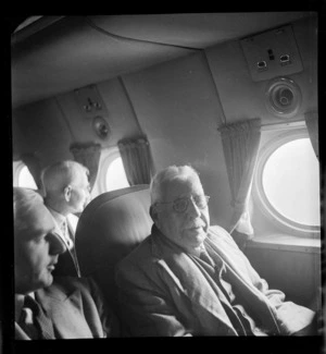 Portrait of Mr A B Wright aged 82 on a Pan American Airways Clipper Class Kathay DC4 passenger plane Good Will Flight, Whenuapai Airfield, Auckland