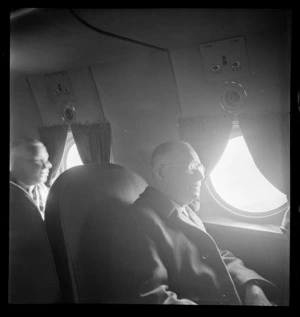 Sir John Allum, Mayor of Auckland City Council, aboard a Clipper aircraft, which is on a goodwill flight