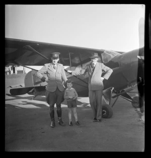 J Claydon, Ross White and Les Rundle, standing alongside monoplane, Mangere, Auckland