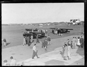 Auckland Aero Club, Mangere, Auckland, showing a general panoramic view of people walking around the airfield, looking at two Rearwin Sportster aircraft's, ZK-AKF, ZK-AKA, and a Beechcroft aircraft