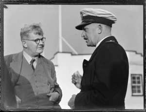 Portrait of Messrs J A Bannon and A V Jury on the arrival of the "Tasman" airboat, Mechanics Bay, Auckland