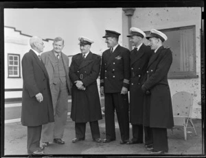 Arrival of "Tasman", Mechanics Bay, Auckland, (L to R): A E Rudden, J A Bannon, Captain A V Jury, Captain Dudley Travers, First Officer J R McQuane, Engineer Officer D Phillips