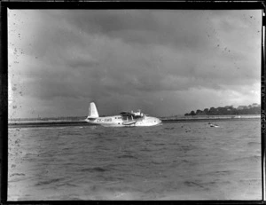 Short Tasman Aircraft (flying boat), Tasman Empire Airways Ltd, showing the Aircraft taxiing into Mechanics Bay, Auckland