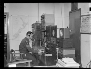 Flying Control Room, Mechanics Bay, Auckland, showing an unidentified man working with on a radio system