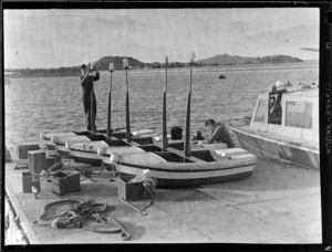 Mechanics Bay, Auckland, showing two unidentified men working on [Lifeboats?] on the dock