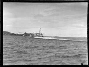 Short Sunderland seaplane, Tainui, taking off from Mechanics Bay, Auckland