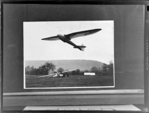 Copy photo of a glider taking off with unidentified spectators looking on, Cambridge Gliding Club on [Madbohs Downs?], England, Great Britain