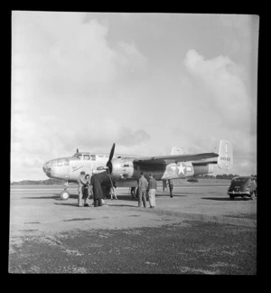 View of the USAAF Mitchell Miss Temperance transport plane after a record trans-Tasman flight (4 hours 33 minutes) with crew, Whenuapai Airfield, Auckland City