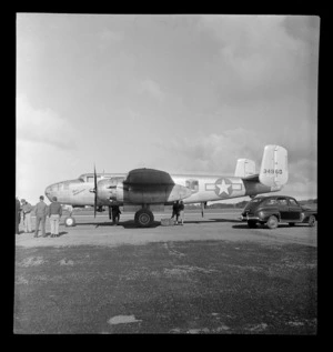 View of the USAAF Mitchell Miss Temperance transport plane after a record trans-Tasman flight (4 hours 33 minutes) with crew, Whenuapai Airfield, Auckland City