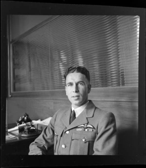 Portrait of Flight Lieutenant W B Pettit of RNZAF 40th Squadron in uniform, Whites Aviation Office, Auckland City