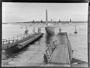 Tasman Empire Airways, Aotearoa aircraft (flying boat in dock), includes harbour, dock and airport workers
