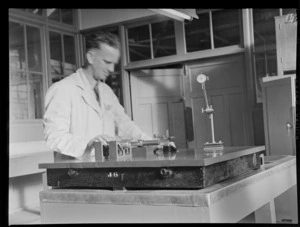 TEAL Activities with an unidentified man working at an instrument testing bench, location unknown, [Auckland?]