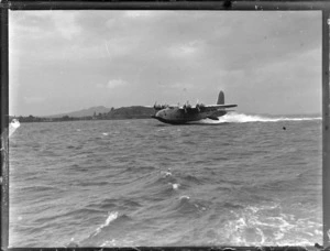View of the arrival of TEAL Short Tasman Flying Boat ZK-AMD 'Australia' on Auckland Harbour, Mechanic's Bay, Auckland City