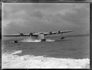View of TEAL Short Tasman Flying Boat ZK-AMD 'Australia' taxiing on Auckland Harbour, Mechanic's Bay, Auckland City