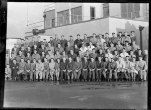 Group portrait of unidentified TEAL Engineering Staff outside a building at Mechanic's Bay, Auckland City