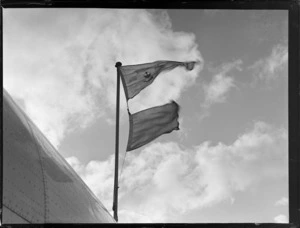 View of a Royal Air Mail flag flying on the TEAL Short Empire Flying Boat Awarua', Mechanic's Bay, Auckland Harbour