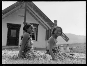 Arareta Clubb and Elsie Whiti sitting outside a wharenui meeting house at an undentified location