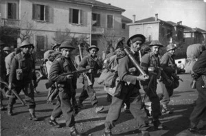 Soldiers of the Maori Battalion moving into line in the Faenza sector, Italy, during World War II