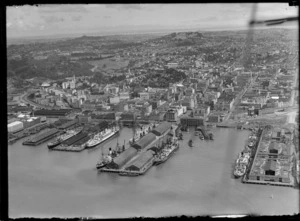 Auckland City waterfront, with some unidentified ships docked at the wharves