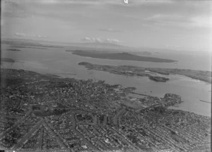 Auckland City and wharves, showing Rangitoto Island in the background