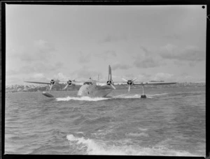 TEAL Short Tasman flying boat ZK-AMD Clipper 'Australia' taxing along the water, Auckland