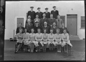 Group portrait of Tasman Empire Airways Limited staff, including G N Roberts, Musick Point Air Radio Station, Howick, Auckland