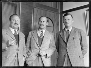 Glover family portrait, Whites Aviation office, Dilworth building, Auckland, (L to R) Captain H L M Glover BOAC (British Overseas Airways Corporation), B G Glover, ex 25, 78, 102 squadrons and Denis Glover, ex Navy Christchurch