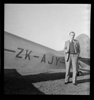 Ernle Clark, Squadron Leader of RAFTC (Royal Air Force Technical College), Mangere, Auckland, next to a Percival Proctor ZK-AJY aircraft