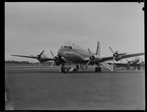 Pan American World Airways aircraft, Douglas DC4 Clipper Mandarin, serviced by maintenance staff, Whenuapai, Auckland