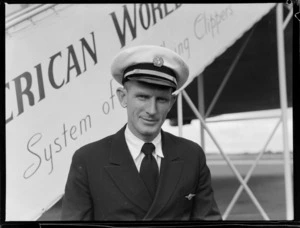 Portrait of Captain R Ford, Pan American Airways pilot, in front of a PAA Clipper Class Aeroplane, Whenuapai Airfield, Auckland