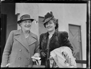 Portrait of Mrs Hudson senior and Mrs Hudson junior in front of an unidentified building, [Auckland?]