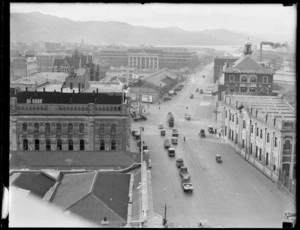 View to a small wooden building by the side of Wellington Railway Station front entrance as the original NZ Air Force Headquarters, Wellington City