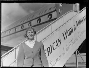 Pan American World Airways stewardess Ann Miller, standing next to Douglas Clipper aircraft