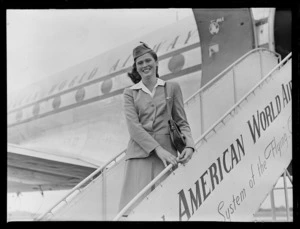 Miss B Mogensen, stewardess for Pan American World Airways, standing on gangway of a Clipper aircraft