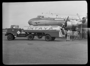 Vacuum Oil Co truck with Intava trailer in front of Pan American World Airways Clipper Lightfoot aircraft