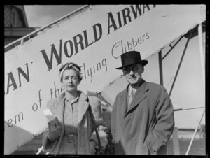 Portrait of Alan Fitts and his wife, [of?] Mair & Company, Christchurch, after their arrival on a Pan American World Airways flight