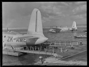 Two Short S-25 flying boats, ZK-AME 'New Zealand' and NZ4103 'Mataatua', moored at Mechanics Bay, Auckland