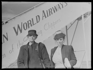 Mrs Mabel Mathewson and Miss A C Affleck, in front of PAWA (Pan American World Airways) aircraft passenger stairs