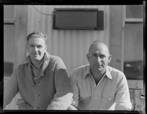 Portrait of (L to R) A H [Plumber?] and C R Parker outside an unknown building, New Plymouth, Taranaki Region