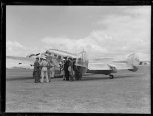 Opening Northland Air Service, Onerahi Aerodrome, Whangarei, showing passengers and air crew ready to board the aircraft