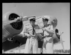 Opening of the Northland Air Service, (L to R) Com G R White and 2nd Officer D M Thomas, in front of a Kahu aircraft