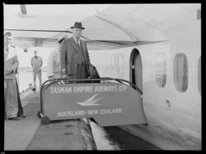 Right Honourable Walter Nash, about to board a Tasman Empire Airways Limited aircraft, Auckland, New Zealand