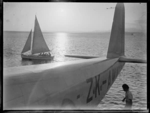 Suva, Fiji, showing boats on harbour at sunset, including Tasman Empire Airways Ltd flying boat 'Aotearoa' ZK-AMA