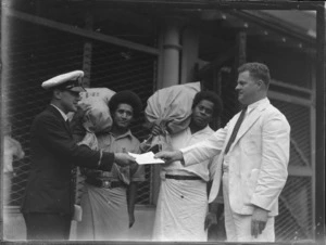 Tasman Empire Airways Ltd postal service between Fiji and New Zealand, showing a group of unidentified men handing over the first delivery of mail, Suva, Fiji