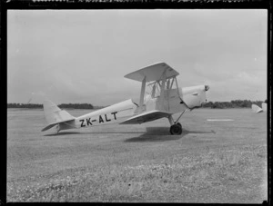 Waikato Aero Club De Havilland Tiger Moth biplane, ZK-ALT, on grass at an unidentified location