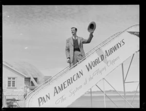 Australian actor John Gaffage on Pan American Airways plane boarding steps, Whenuapai Airfield, Auckland