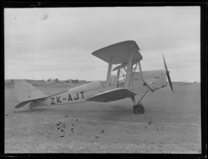 View of the Tiger Moth ZK-AJT 'Tauranga A/C' with marlin engine casing insignia, Mangere Airport, Auckland