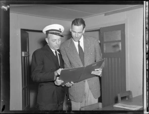 PAWA (Pan American World Airways) Captain L Williams (left), conferring with Mr Quin Campbell (Station Manager), after arrival of PAWA clipper from America