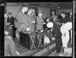 Passengers being checked by New Zealand Customs officials, arrival of PAWA (Pan America World Airways) clipper from America